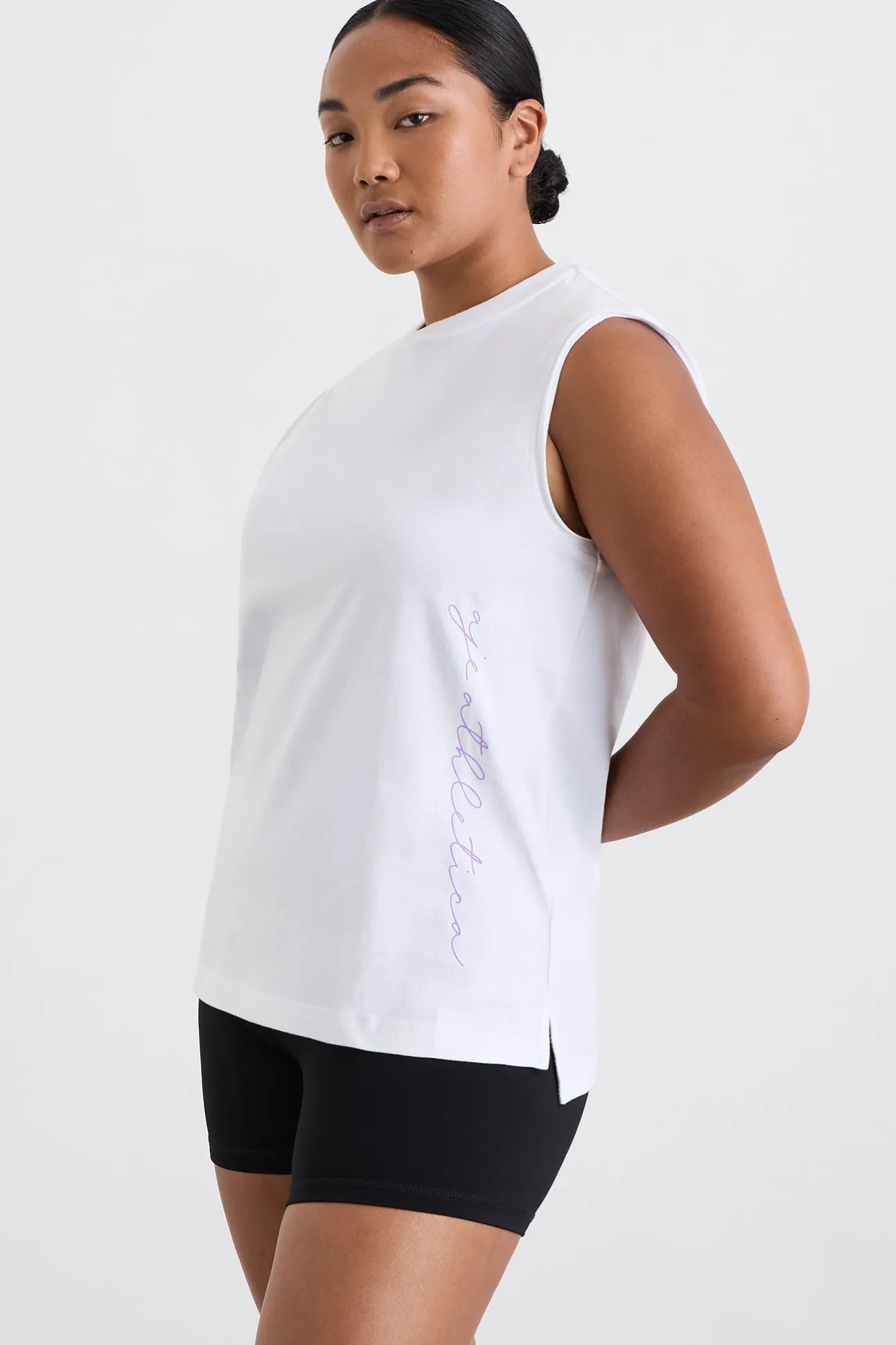 cursive_logo_longline_tan_0.webp Cursive Logo Longline Tank 101