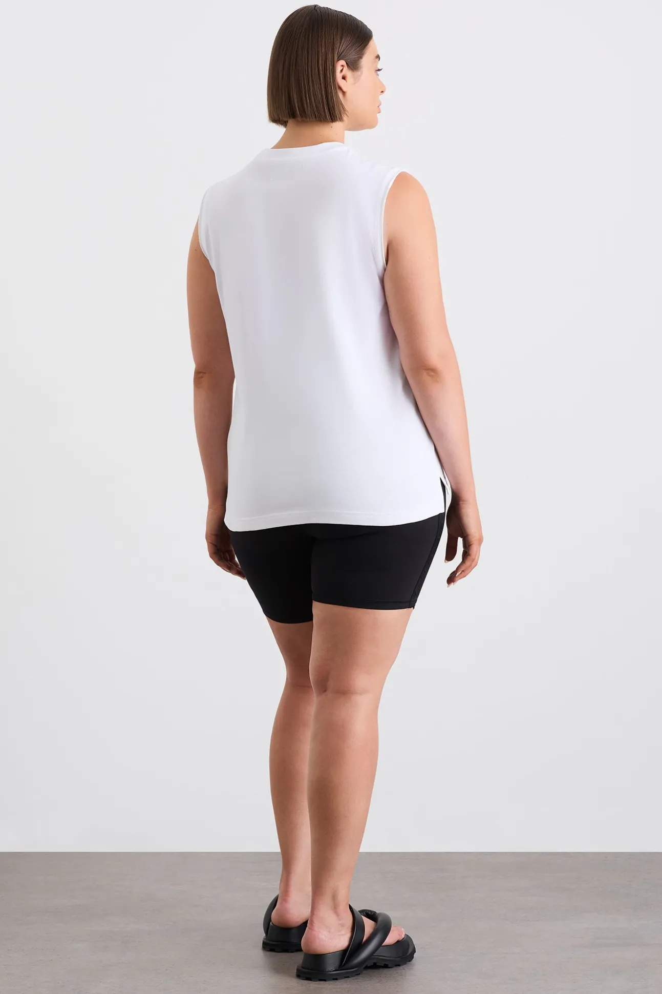 cursive_logo_longline_tan_10.webp Cursive Logo Longline Tank 101